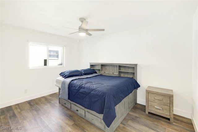 bedroom with dark wood-type flooring and ceiling fan