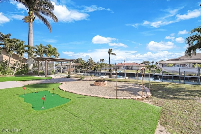 view of home's community featuring a water view, a gazebo, and a lawn