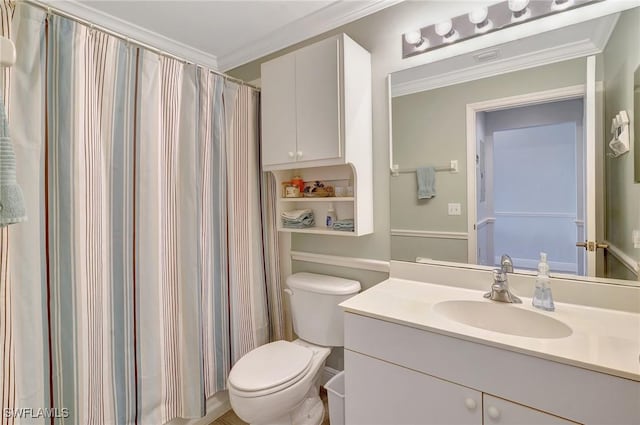 bathroom with ornamental molding, toilet, curtained shower, and vanity