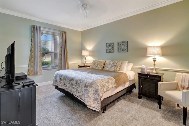 carpeted bedroom with crown molding and ceiling fan