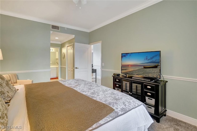 carpeted bedroom featuring ornamental molding, ceiling fan, and ensuite bathroom