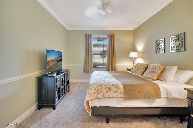 carpeted bedroom with crown molding and ceiling fan