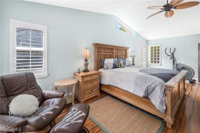 bedroom with hardwood / wood-style flooring, ceiling fan, vaulted ceiling, and multiple windows