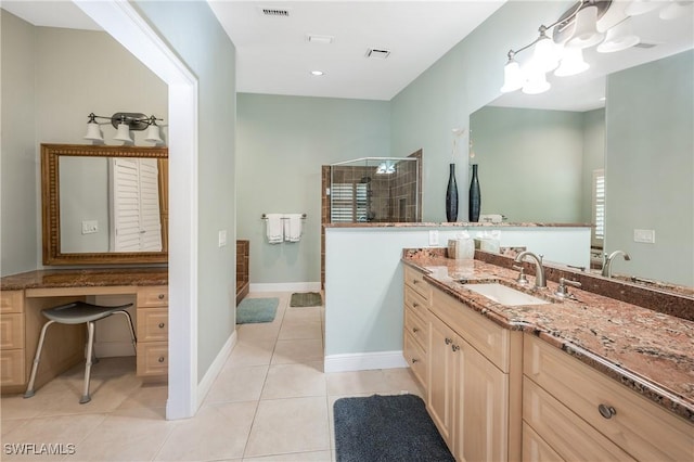 bathroom with vanity, tile patterned floors, and walk in shower