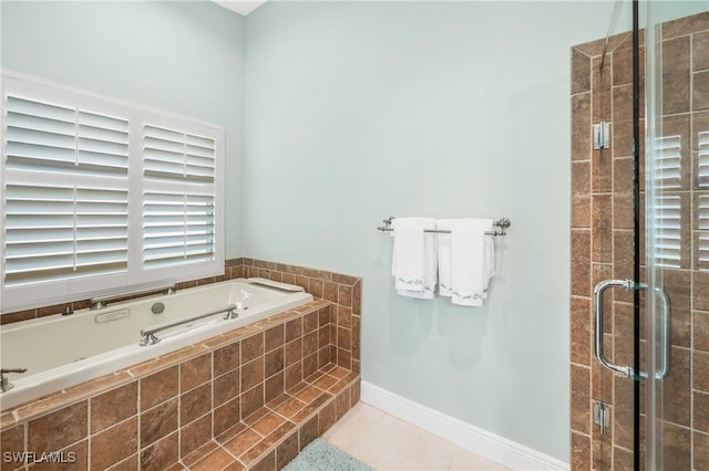 bathroom featuring tile patterned floors and shower with separate bathtub