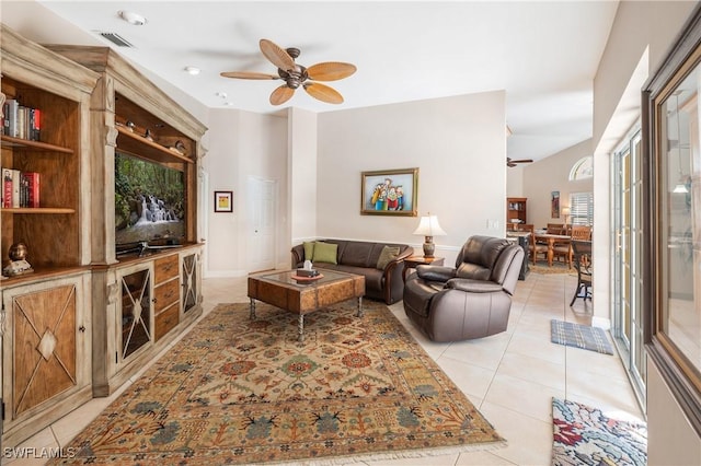 living room featuring light tile patterned flooring and ceiling fan