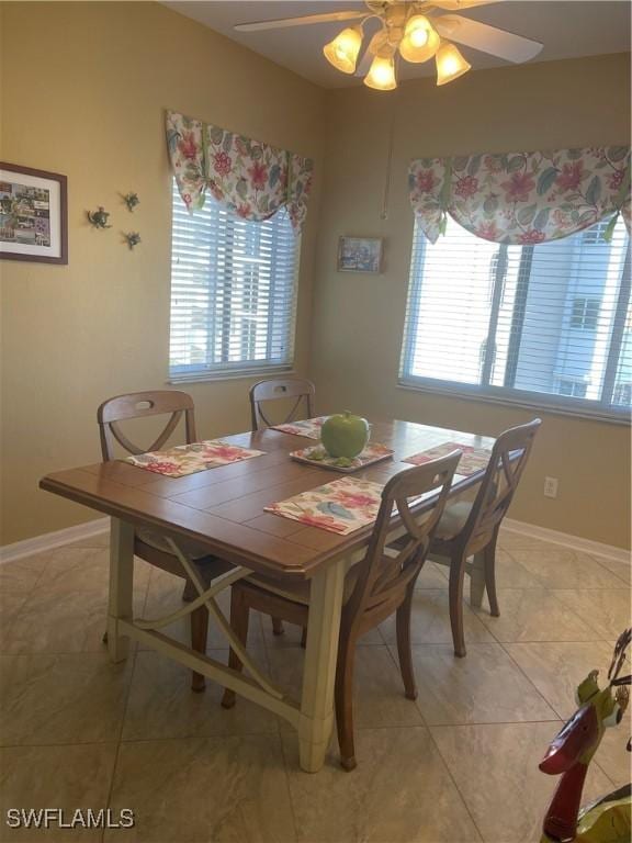 dining room featuring light tile patterned floors and ceiling fan