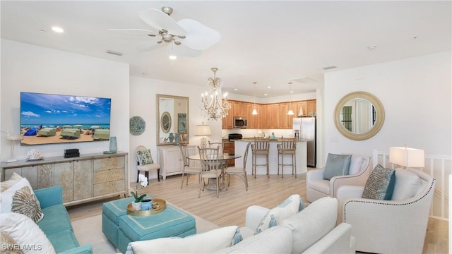 9078 Albion Ln S Unit 6603, Naples, FL 34113 - living area featuring light wood-type flooring, a chandelier, ceiling fan, and recessed lighting