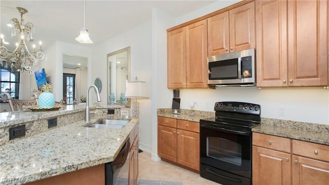 9078 Albion Ln S Unit 6603, Naples, FL 34113 - kitchen with appliances with stainless steel finishes, a sink, light stone counters, and a chandelier