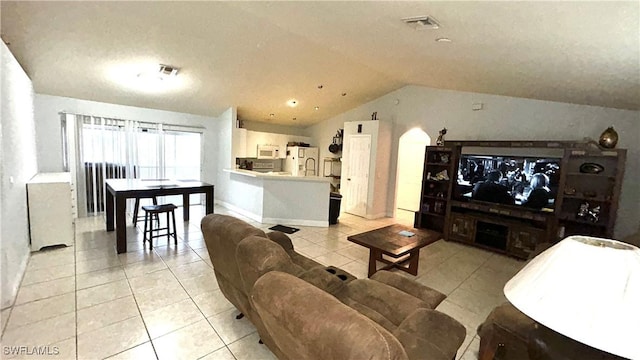 tiled living room featuring lofted ceiling