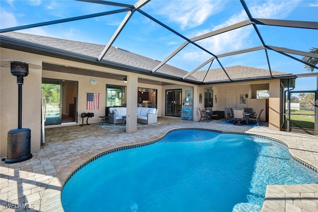 view of pool with an outdoor hangout area, a lanai, and a patio area