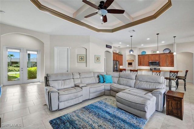 living room with french doors, ceiling fan, and light tile patterned flooring