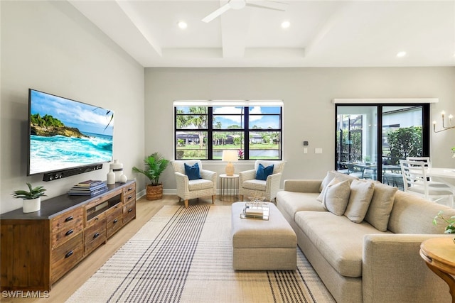 living room with a ceiling fan, light wood-type flooring, baseboards, and recessed lighting