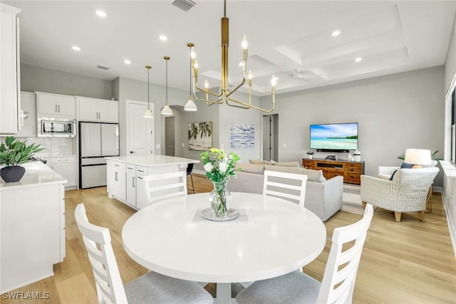 dining room with recessed lighting, visible vents, coffered ceiling, and light wood-style flooring