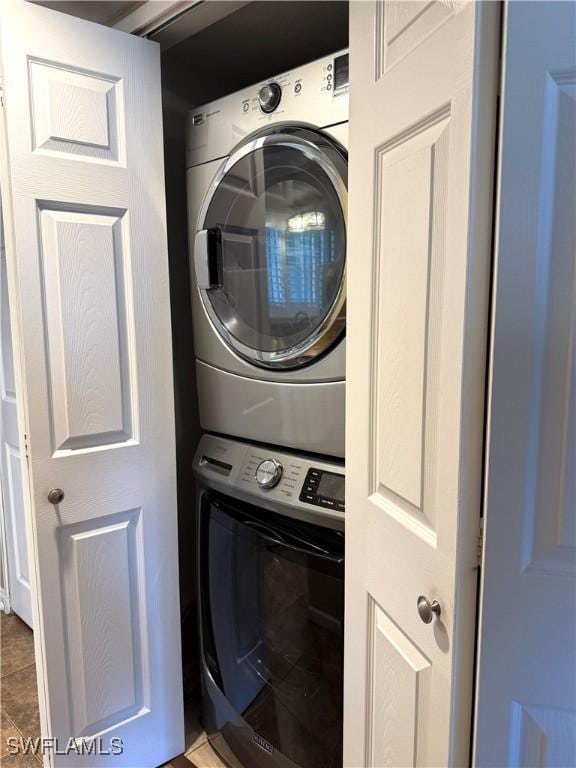 laundry area featuring stacked washer and dryer