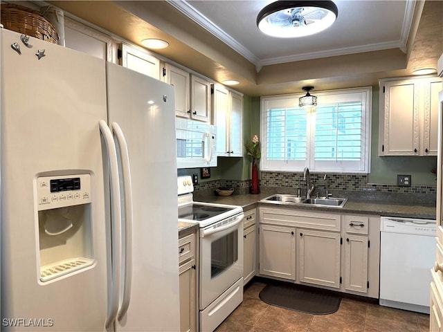 kitchen with white appliances, white cabinetry, sink, and ornamental molding