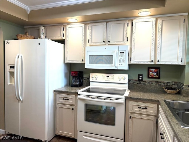 kitchen featuring white appliances, ornamental molding, and white cabinets