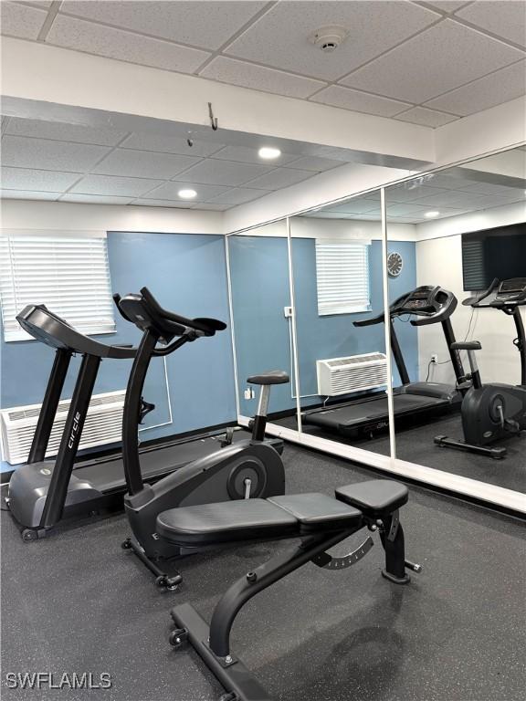 gym featuring a paneled ceiling