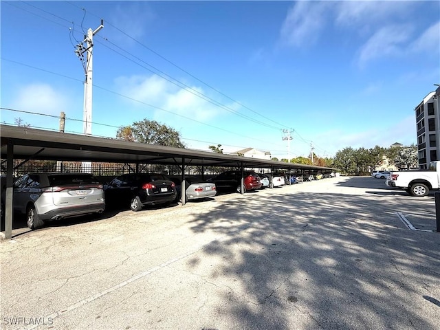 view of vehicle parking featuring a carport