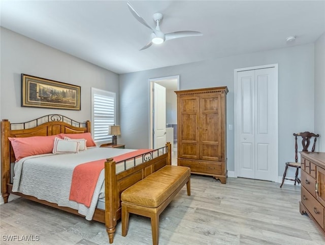 bedroom with a closet, ceiling fan, and light wood-type flooring