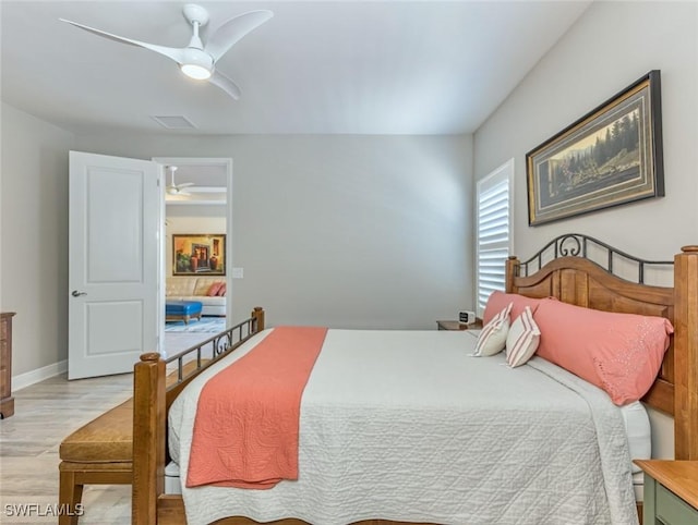 bedroom with ceiling fan and light wood-type flooring