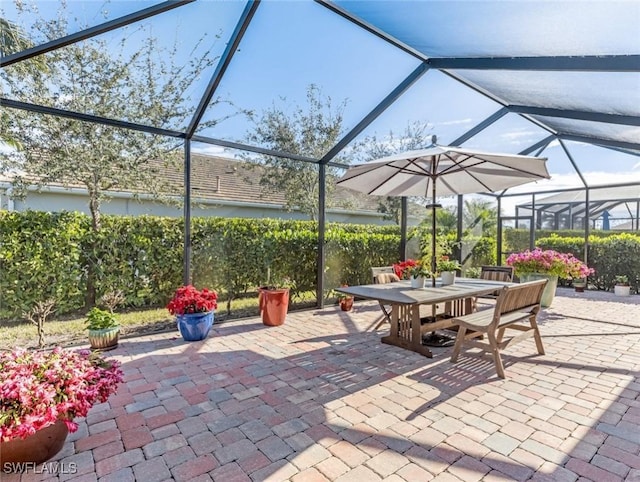 view of patio / terrace featuring a lanai