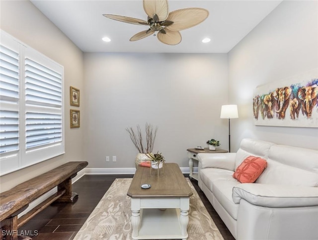 living room with dark hardwood / wood-style floors and ceiling fan