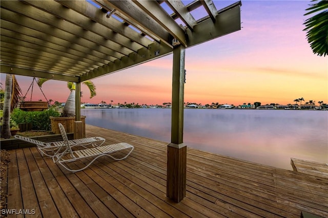 dock area with a water view and a pergola