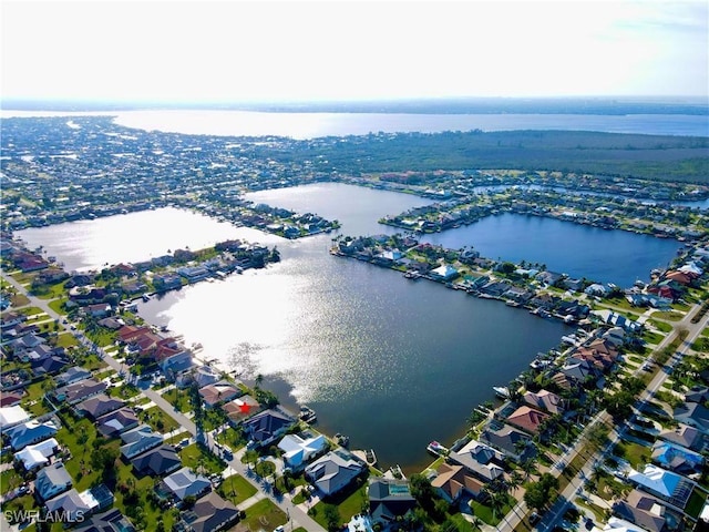 bird's eye view with a residential view and a water view