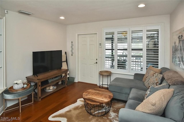 living room with dark hardwood / wood-style floors