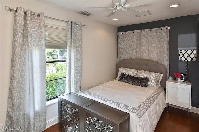 bedroom with ceiling fan and dark hardwood / wood-style flooring