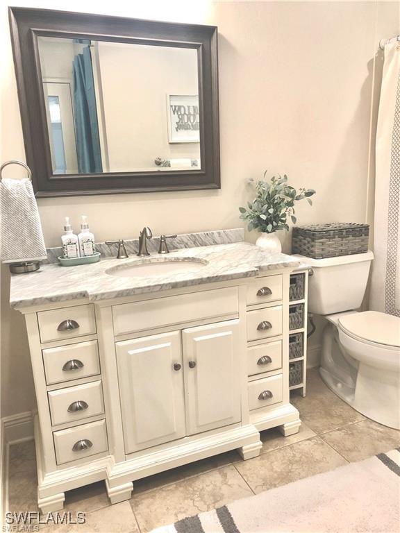 bathroom with vanity and toilet