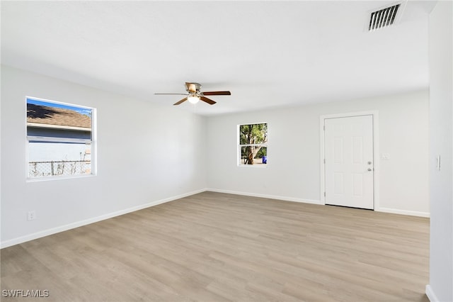 unfurnished room with light hardwood / wood-style flooring and ceiling fan