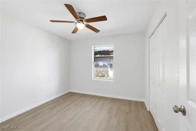 spare room featuring ceiling fan and light wood-type flooring