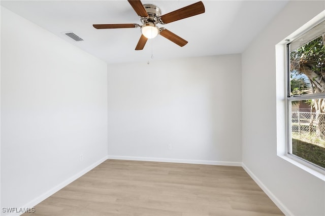 spare room with ceiling fan and light hardwood / wood-style flooring