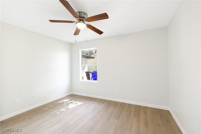 spare room with ceiling fan and light hardwood / wood-style floors