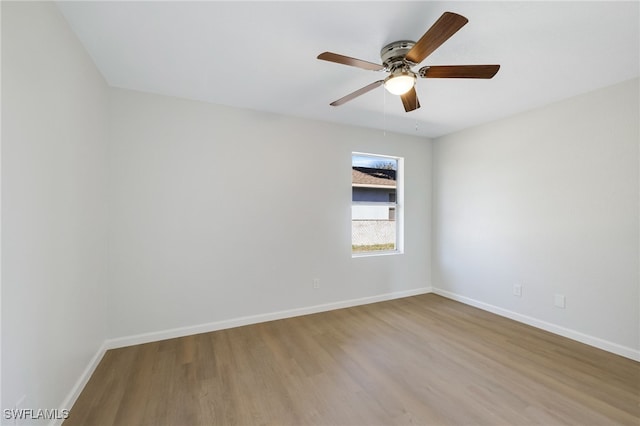 unfurnished room featuring hardwood / wood-style floors and ceiling fan