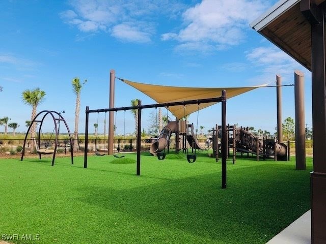 view of play area featuring a lawn