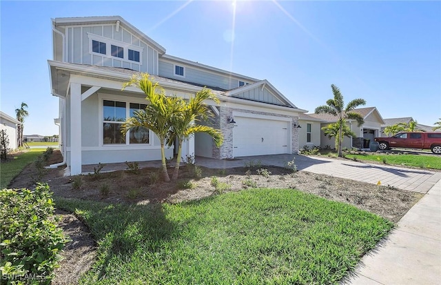 view of front of home with a garage and a front yard