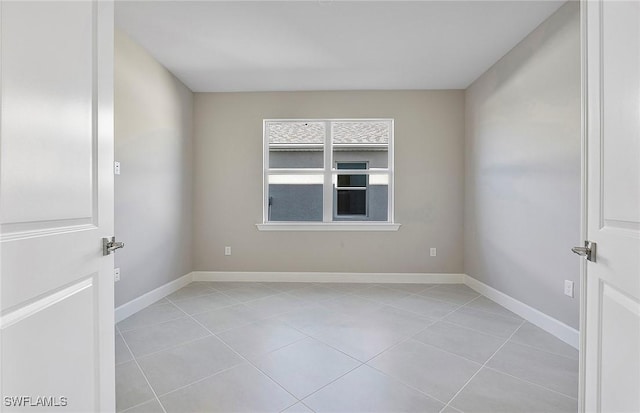 unfurnished room with light tile patterned floors