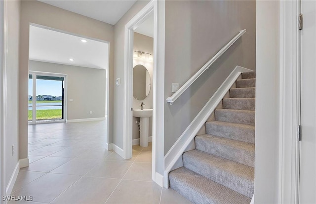 stairs with tile patterned floors