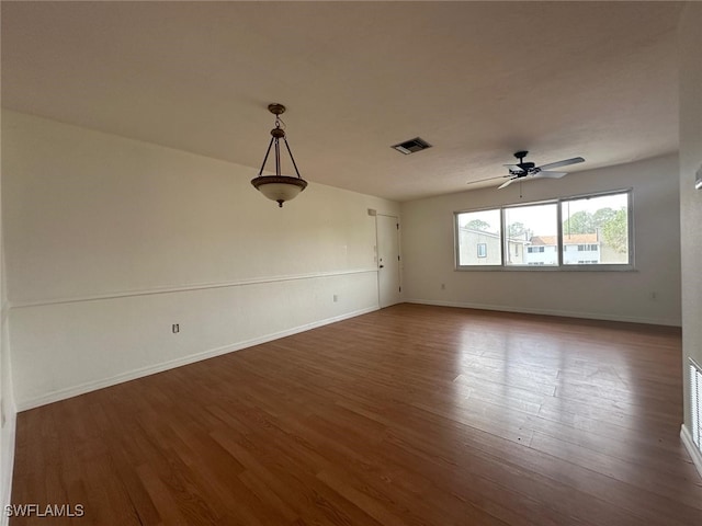 unfurnished room featuring hardwood / wood-style flooring and ceiling fan