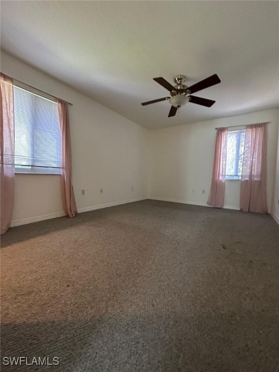 unfurnished room with ceiling fan and carpet floors