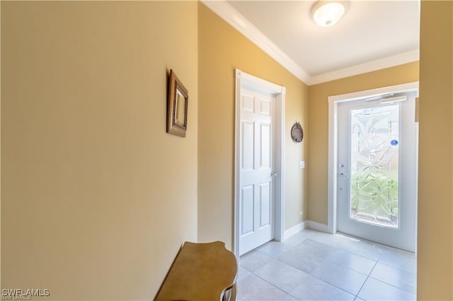 foyer entrance featuring light tile patterned flooring and ornamental molding