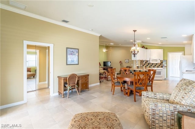 tiled dining space featuring crown molding