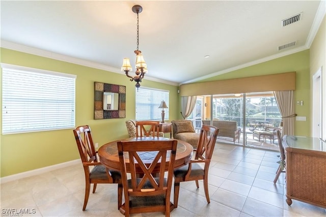 dining space featuring vaulted ceiling, crown molding, plenty of natural light, and light tile patterned floors