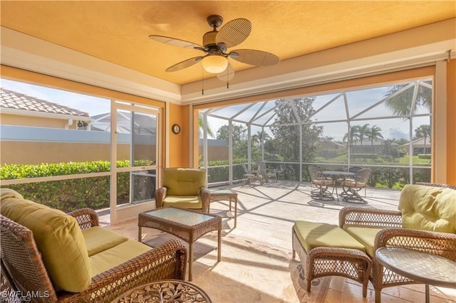 sunroom with ceiling fan and a wealth of natural light