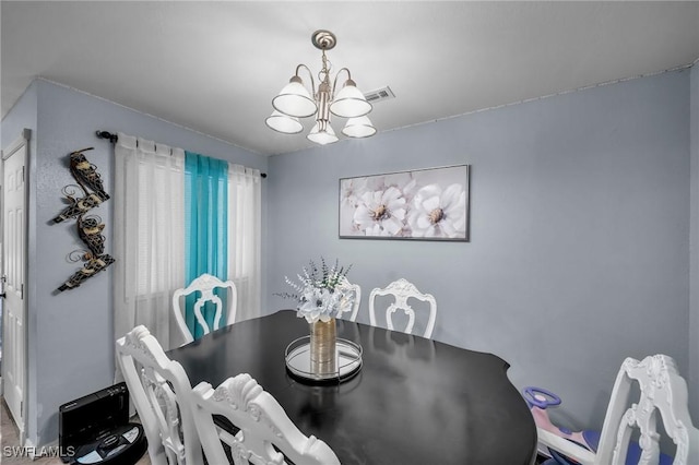 dining room featuring an inviting chandelier