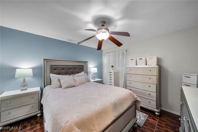 bedroom featuring ceiling fan and dark hardwood / wood-style flooring