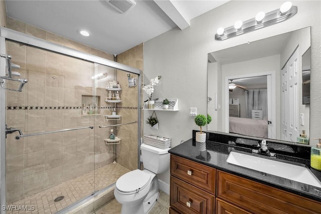 bathroom featuring vanity, an enclosed shower, tile patterned floors, and toilet